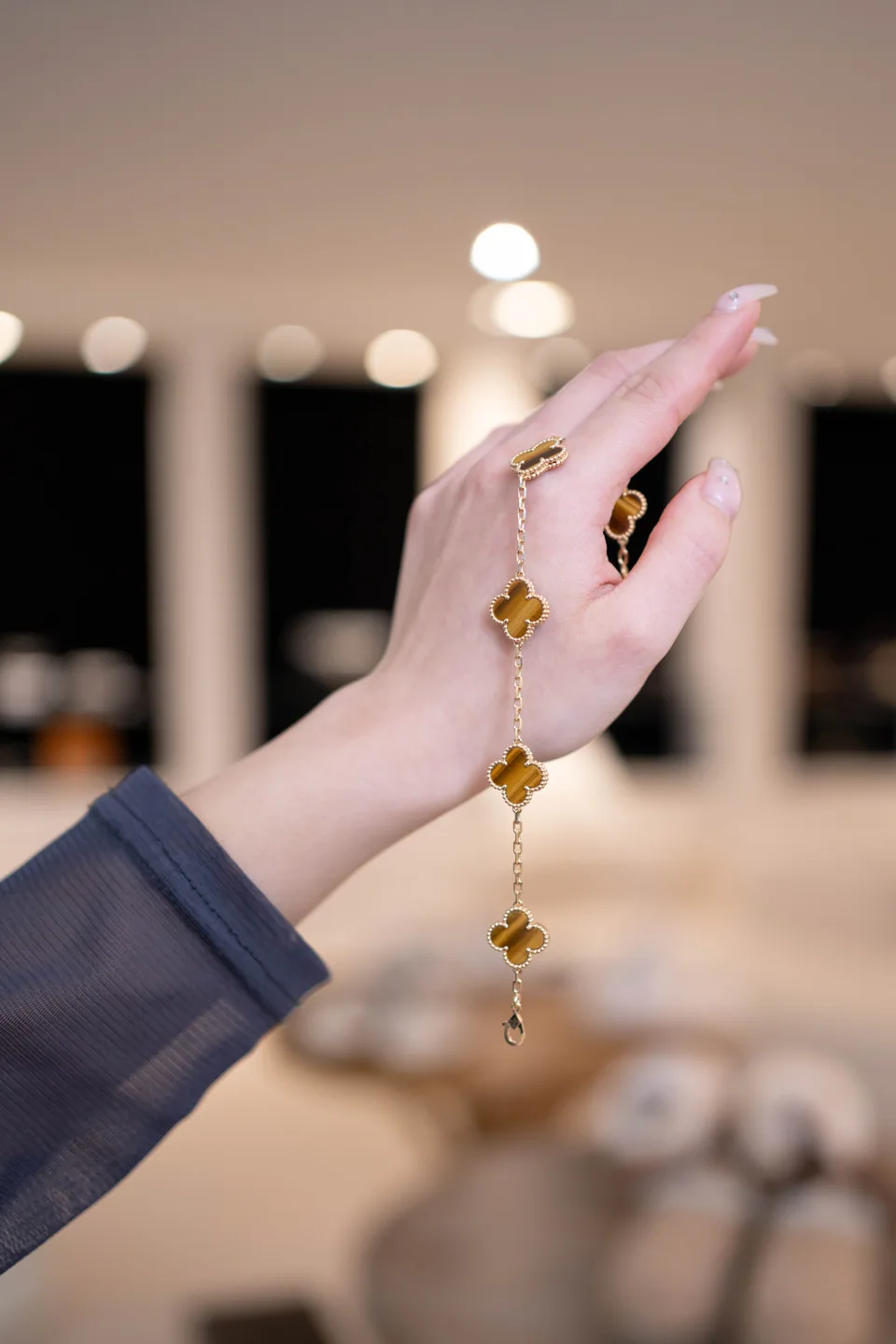 A close view of a jewellery piece worn on the wrist